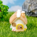 Miniature dollhouse cottage with thatched roof and colorful flowers for farm scenery - House