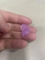 Micro purple translucent resin axolotl figurine held on a fingertip for size - Purple Axolotl (Style J)
