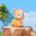 Cute resin deer figurine with pink heart antlers on a wooden stump for garden decor - Smiling Sitting Deer Style D