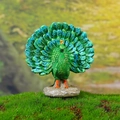 Resin peacock figurine with vibrant green feathers on rock base for garden decor - Open Tail Peacock (B Style)
