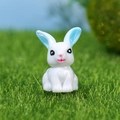 Figurine lapin blanc en résine aux oreilles bleues pour décor de jardin - Lapin