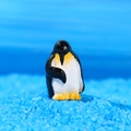 Miniature resin penguin figurine in classic black and white for micro landscape decor - Bowing Penguin (Style B)