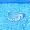 Miniature resin penguin ice cube decoration with frosted blue finish on micro sand - Style E