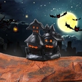 3D black Halloween ghost house ornament with glowing orange pumpkin eyes and mouth - Style G
