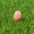 Pink resin Easter egg miniature figurine on green grass for micro landscape decor - Pink Easter Egg