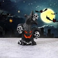 Halloween resin tree stump ornament with white skulls and glowing orange pumpkin face - Skeleton Tree