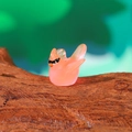 Luminous resin hummingbird miniature in translucent pinkish-orange for garden decor - Luminous Pink