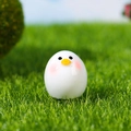 Miniature white chick resin ornament with yellow beak and pink cheeks on green grass - Round White Chick (Style C)