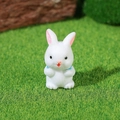 Miniature white resin bunny figurine with blue collar on green lawn landscape - Sitting Style (Model A)