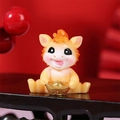 Cute yellow zodiac horse resin figurine holding a gold ingot for festive luck - Sitting Horse with Ingot