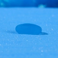 Deep blue translucent artificial sea glass stone on glittery sand for aquarium decor - Dark Blue Flat Oval Decorative Stone (Size S)
