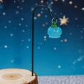 Luminous pale blue flower bud pendant on a wooden stand with a starry background - Glow Blue Lantern With Iron Hook