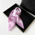 Macro detail of elegant pink floral silk scarf on display tray for premium styling - 70cmx70cm / Pink