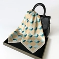 Elegant geometric square silk scarf with beige and turquoise gradient pattern on handbag - Green