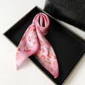 Elegant pink silk scarf with floral pattern displayed in a black minimalist tray - Square Style / Pink