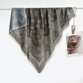 Close-up of silk scarf featuring paisley and mandala patterns with herringbone weave - Color 15