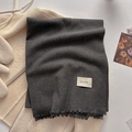 Deep grey autumn winter scarf with soft fringes and brand label on white sweater - Dark Gray