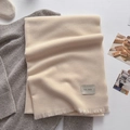Beige herringbone knit scarf with woven tag and soft fringes for autumn winter - Off White