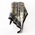 Macro detail of satin silk scarf featuring classic golden paisley patterns and black borders - 90x90cm / Black
