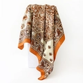 Detailed shot of satin square scarf with vintage paisley print and glossy silk texture - 90x90cm / Orange