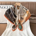 Detail of artistic abstract print silk scarf with orange contrast piping tied on white dress - Color 14