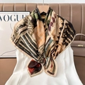Detail of vintage abstract print silk scarf draped elegantly over a white shirt - Color 35