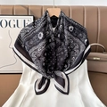 Detail of classic paisley silk scarf with black and white patterns on elegant suit - Color 3