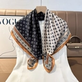Detail of silk scarf with geometric pattern and contrast border on white dress - Color 9