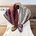 Detailed view of bicolor silk scarf featuring vintage geometric patterns and striped borders - Color 30