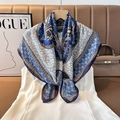 Detail of luxury silk square scarf with blue paisley pattern and herringbone texture - Color 17