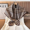 Detail of silk square scarf featuring classic plaid patterns draped over a white dress - Color 19