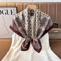 Detail of elegant paisley silk scarf with burgundy border styled on a white dress - Color 7