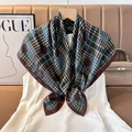 Close-up of silk square scarf featuring houndstooth pattern and large red polka dots - Color 11