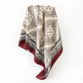 Detail of silk satin square scarf with paisley patterns draped over geometric props - 90x90cm (D9496) / Red