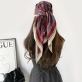 Fashionable paisley print triangle scarf worn as a bohemian silk headwrap and shawl - Red