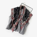 Polka dot silk scarf with red paisley border paired with grey vest on hanger - Black