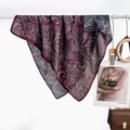 Elegant burgundy paisley square scarf in silky fabric draped on a stylish wooden hanger - Intricate Paisley Wine Red