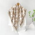 Beige and brown geometric satin silk scarf paired with a white blazer for elegant styling - Beige Geometric Monogram / Beige