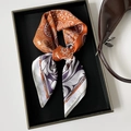 Detail of silk-like paisley square scarf in orange and purple on a luxury tray - 70cmx70cm / Orange