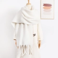 Detail of soft white mohair scarf with tassels on mannequin for winter styling - White
