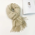 Detail of beige cashmere-feel scarf showing soft texture and fine twisted fringe tassels - 74.8*27.5inch / Beige