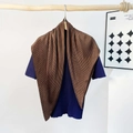 Detailed view of dark brown accordion pleat scarf draped on a wooden stand - Pleating / Brown