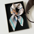 Elegant white satin twilly scarf with yellow clover print and blue geometric edge - Cyan