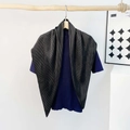 Detail showing the pleated texture of the silk scarf and ribbed knit shirt fabric - Pleating / Black