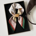 Elegant satin clover print silk-like scarf with green and red stripes on display - Dark Green
