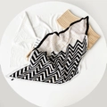 Detail of pleated silk scarf featuring black white chevron patterns and orange polka dots - Yellow Polka Dot