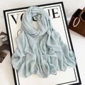 Detailed texture of light blue linen-style scarf displayed on a Vogue magazine board - 185*90cm / Light Blue (M8946)