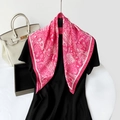 Rose red paisley satin square scarf with bohemian patterns draped on a model - Pink