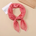 Macro detail of breathable coral pink silk scarf with high-quality white hemmed edges - Watermelon red