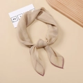 Detail of light beige satin scarf with purple trim and elegant tied knot texture - Khaki